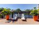 Relaxing pool deck with lounge chairs overlooking a scenic pond and fountain, offering a serene outdoor escape at 7903 Seminole Blvd # 2103, Seminole, FL 33772