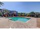Community pool with brick deck, lounge chairs, and a pergola covered seating area for relaxation and entertaining at 7903 Seminole Blvd # 2103, Seminole, FL 33772