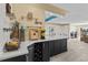 Stylish bar area featuring a wine rack, glass shelving, and countertop space, perfect for entertaining at 8014 12Th S Ave, St Petersburg, FL 33707