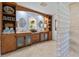 Spacious bathroom with double vanities, custom cabinetry, and a unique glass block shower at 8014 12Th S Ave, St Petersburg, FL 33707