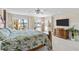 Bedroom with water views, sliding glass doors, and wooden furniture at 8014 12Th S Ave, St Petersburg, FL 33707