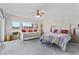 Inviting bedroom with waterfront view, slider door, and bright furnishings at 8014 12Th S Ave, St Petersburg, FL 33707