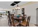 Dining room with a round table, seating for six, modern lighting fixture, and water view at 8014 12Th S Ave, St Petersburg, FL 33707