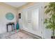 Elegant foyer with decorative doors, a stylish rug, and unique wall decor at 8014 12Th S Ave, St Petersburg, FL 33707