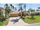 Inviting single-story home with tile roof and palm trees at 8014 12Th S Ave, St Petersburg, FL 33707