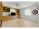 Bright living room featuring custom built-ins, neutral tones, and natural light from the arched window at 8014 12Th S Ave, St Petersburg, FL 33707