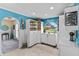 Spacious pantry with ample shelving, storage cabinets, and a charming arched window at 8014 12Th S Ave, St Petersburg, FL 33707