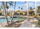 Backyard pool and spa with lush, tropical landscaping and waterfront views at 8014 12Th S Ave, St Petersburg, FL 33707