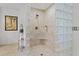 Modern shower with glass block partition, sleek fixtures, and neutral tile at 8014 12Th S Ave, St Petersburg, FL 33707