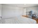 Spacious bedroom with hardwood floors, neutral walls, and a designated work area at 8439 Boxwood Dr, Tampa, FL 33615