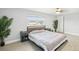 Bedroom with a ceiling fan, light gray walls, and tile flooring at 8439 Boxwood Dr, Tampa, FL 33615