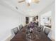 Elegant dining room showcases sleek table setting and easy access to the kitchen at 8439 Boxwood Dr, Tampa, FL 33615