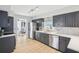 Updated kitchen with stainless steel appliances, sleek cabinetry, and seamless countertops at 8439 Boxwood Dr, Tampa, FL 33615