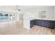 Bright living area with a breakfast bar, stylish cabinets, and access to the backyard at 8439 Boxwood Dr, Tampa, FL 33615