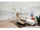 Airy living room featuring a large sectional, modern furnishings, and ample lighting at 8439 Boxwood Dr, Tampa, FL 33615