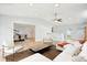 Inviting living room with an open layout to the dining area and natural light at 8439 Boxwood Dr, Tampa, FL 33615