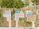 Aerial view of homes with screened pools and well-maintained yards at 9069 Gaynor St, Spring Hill, FL 34608