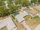 Aerial view showcases a large house with a screened-in pool and spacious yard at 9069 Gaynor St, Spring Hill, FL 34608