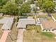 Aerial view of home with well-maintained yard, pool, and privacy fence at 9069 Gaynor St, Spring Hill, FL 34608