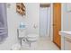 Functional bathroom with toilet, shower stall, and shelf at 9069 Gaynor St, Spring Hill, FL 34608