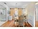 Dining room with hardwood floors and sliding barn doors at 9069 Gaynor St, Spring Hill, FL 34608