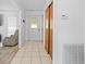 Front entryway featuring tiled floors, closet and front door at 9069 Gaynor St, Spring Hill, FL 34608