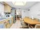 Kitchen features a long countertop and a built in table for eat in dining at 9069 Gaynor St, Spring Hill, FL 34608