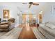 Open-concept living and dining area featuring barn doors, updated flooring, and lots of natural light at 9069 Gaynor St, Spring Hill, FL 34608