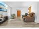 Inviting living room with neutral walls, wood-look floors, and relaxing seating at 9069 Gaynor St, Spring Hill, FL 34608