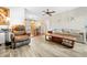 Open living room and dining area, with wood-look floors and neutral tones at 9069 Gaynor St, Spring Hill, FL 34608