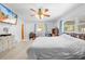 Spacious main bedroom with ceiling fan, large window and walk-in closet at 9069 Gaynor St, Spring Hill, FL 34608