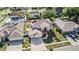 Expansive aerial view of a two-story home featuring a paved driveway and a manicured lawn in a residential neighborhood at 10003 Vista Pointe Dr, Tampa, FL 33635