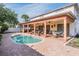 Spacious backyard featuring a covered patio, a refreshing swimming pool, and ample space for entertaining at 10003 Vista Pointe Dr, Tampa, FL 33635