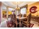 Formal dining room with elegant chandelier, decorative rug, and ample seating for gatherings at 10003 Vista Pointe Dr, Tampa, FL 33635