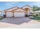 Charming home boasts an attached two-car garage and a brick-paved driveway leading to a grand entrance at 10003 Vista Pointe Dr, Tampa, FL 33635