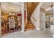 Inviting foyer featuring a staircase, dining room, and access to the living area at 10003 Vista Pointe Dr, Tampa, FL 33635
