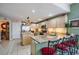 The kitchen boasts granite countertops, stainless steel appliances, and an island at 10003 Vista Pointe Dr, Tampa, FL 33635