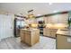 Spacious kitchen with granite countertops, stainless steel appliances, and a central island at 10003 Vista Pointe Dr, Tampa, FL 33635
