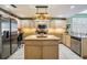 Well-equipped kitchen with stainless steel appliances, granite counters, and ample cabinet space at 10003 Vista Pointe Dr, Tampa, FL 33635