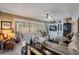 The living room offers built-in shelving, plantation shutters, and comfortable seating at 10003 Vista Pointe Dr, Tampa, FL 33635
