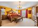 Luxurious main bedroom with ornate furnishings, decorative bedding, and ample closet space at 10003 Vista Pointe Dr, Tampa, FL 33635