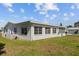 Side view of a one-story home with a fenced patio and a neatly maintained lawn at 10155 36Th N Way, Pinellas Park, FL 33782