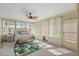 Sunroom with bed, ceiling fan and bright light at 10155 36Th N Way, Pinellas Park, FL 33782
