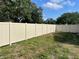 Large fenced-in backyard with mature trees and plenty of green space at 11241 Temple Ct, Seminole, FL 33772