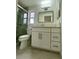 Clean bathroom features granite countertops, new cabinets, and a glass shower at 11241 Temple Ct, Seminole, FL 33772