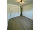 Bedroom with closet and neutral paint at 11241 Temple Ct, Seminole, FL 33772