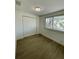 Bedroom with window and closet at 11241 Temple Ct, Seminole, FL 33772