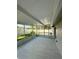 The screened lanai is spacious, with views of the brick paver patio and backyard at 11241 Temple Ct, Seminole, FL 33772