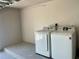 Modern laundry room with newer Samsung washer and dryer at 11241 Temple Ct, Seminole, FL 33772