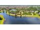 Aerial view showcases a stunning community with a lake, recreational areas, and well-maintained landscaping at 11862 Frost Aster Dr, Riverview, FL 33579